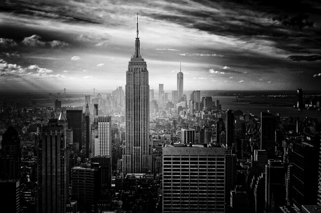 Black and white photo of the Empire State Building and downtown New York City